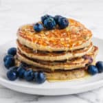 Vegan Blueberry Pancakes served with fresh blueberries