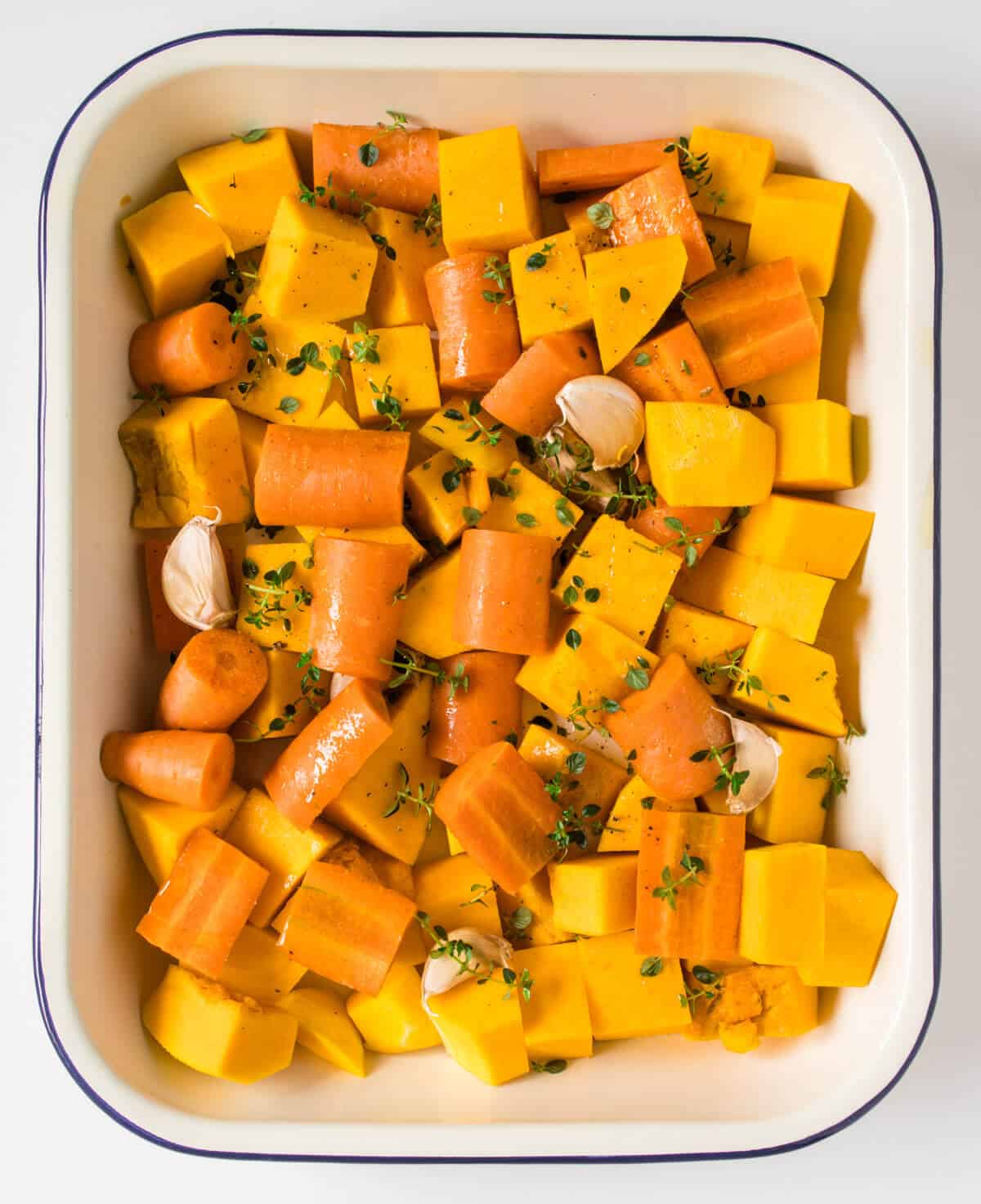 Pumpkin, carrots, garlic and thyme before going into the oven