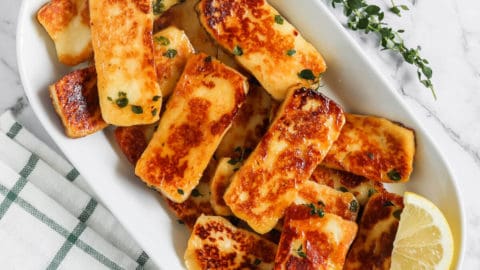 Honey Glaze Halloumi served on a plate with lemon