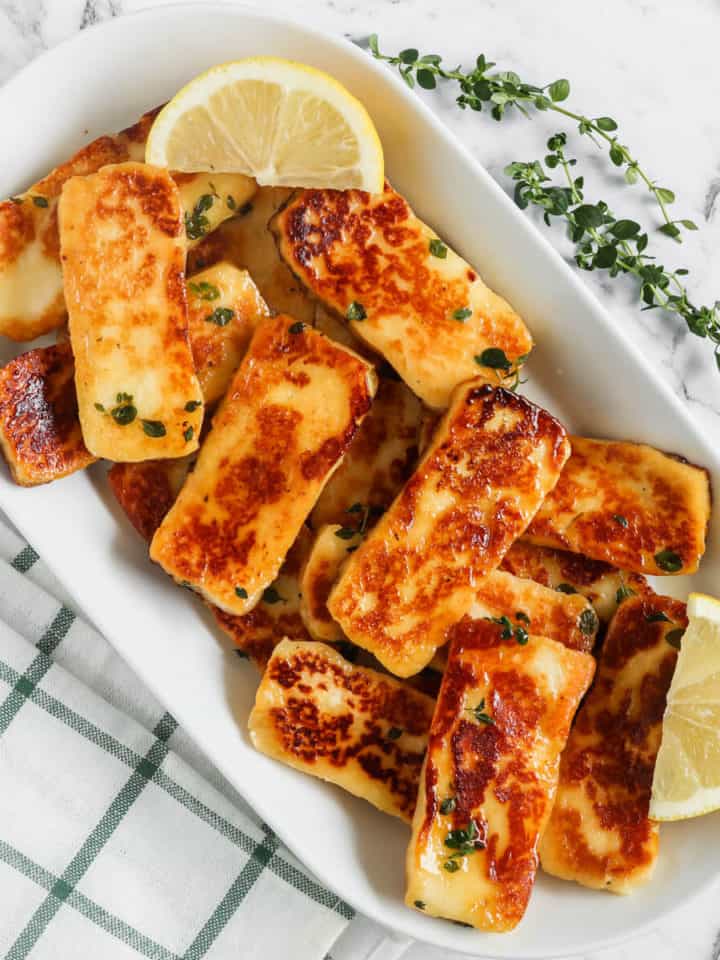 Honey Glaze Halloumi served on a plate with lemon