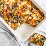 Vegetable Frittata in baking dish with one piece removed