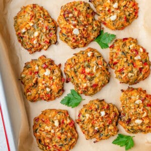 Freshly baked vegetable fritters on an oven tray