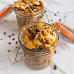 Chocolate Peanut Butter Overnight Oats topped with cacao nibs, banana and peanut butter