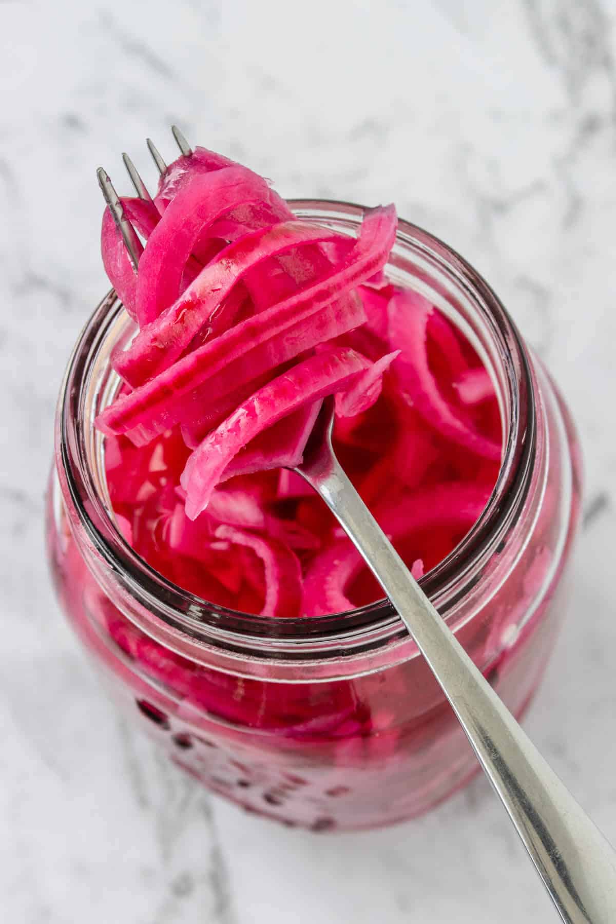 Close up of Quick Pickled Onions on a fork