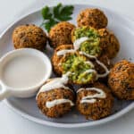 Fried Falafel drizzled with tahini sauce