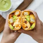 Vegetarian breakfast burrito cut in half to show the inside