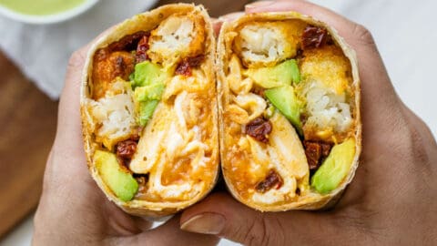 Vegetarian breakfast burrito cut in half to show the inside