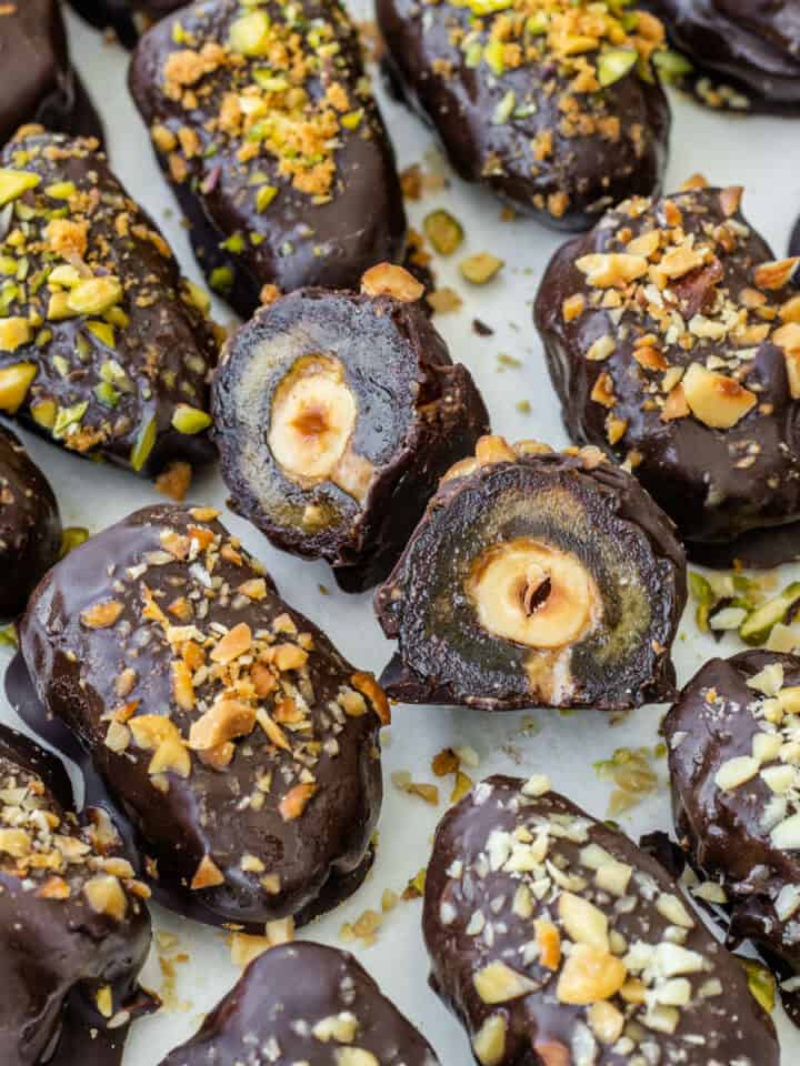 Chocolate dates with one date cut in half to show the inside filling