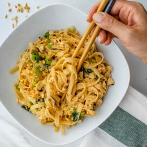 Peanut Noodles being eaten with chopping sticks
