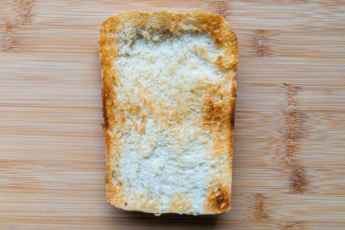 Slice of toasted bread on how to make burrata toast