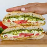Burrata Caprese sandwich with tomato, basil pesto and burratina