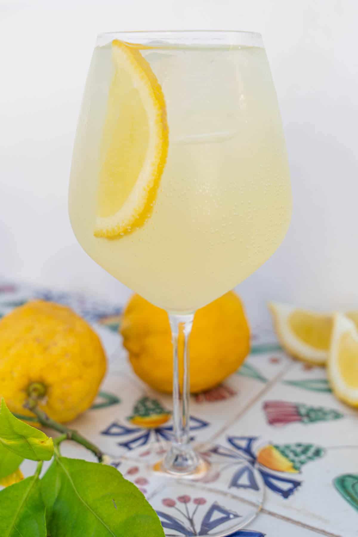 Limoncello Spritz served in a glass and garnish of lemon