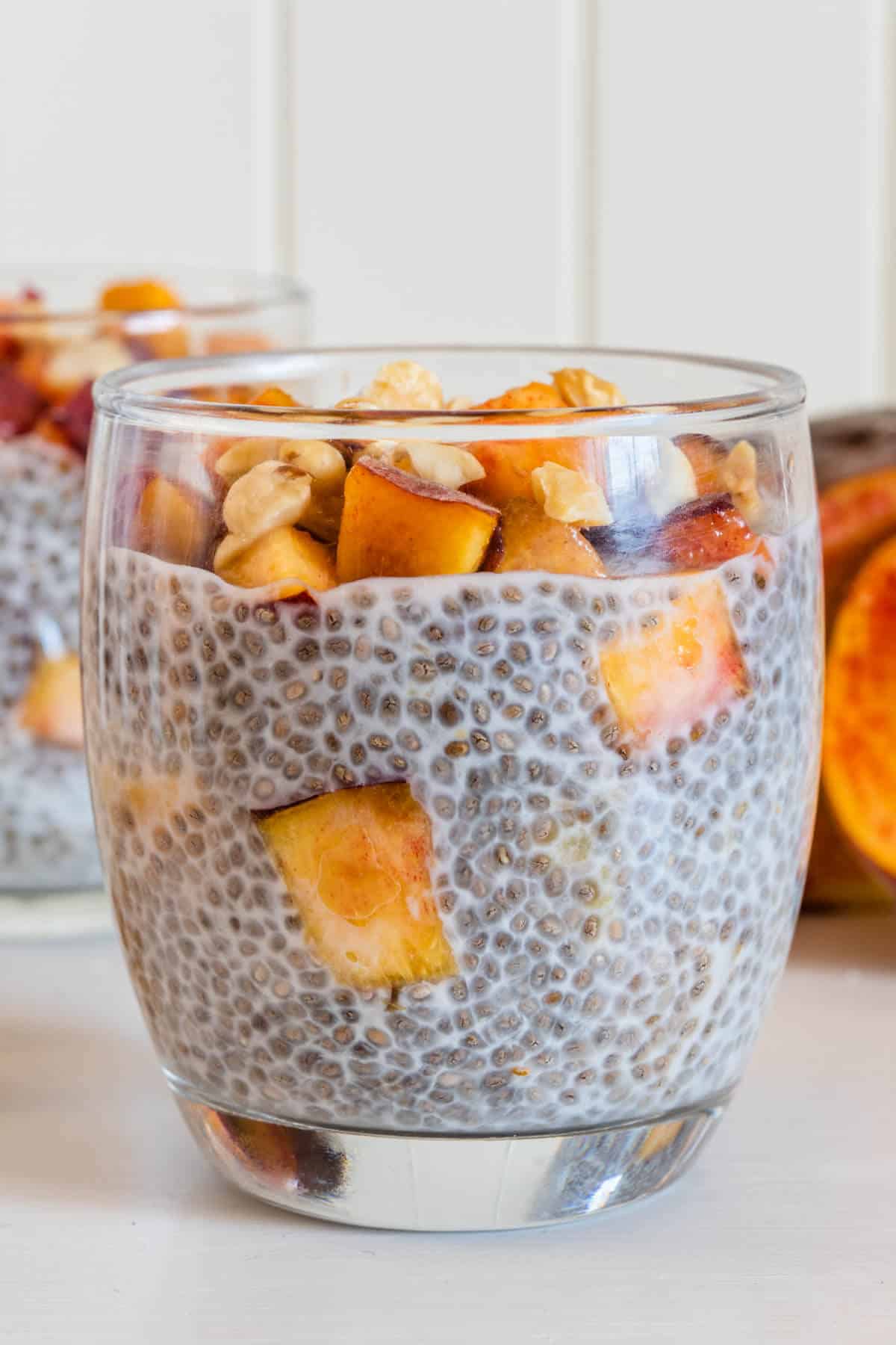Close up of cup of peach chia pudding