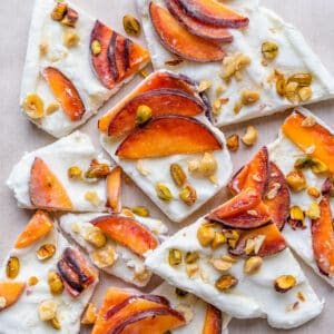 Frozen yogurt bark cut with fruit and nuts cut into pieces