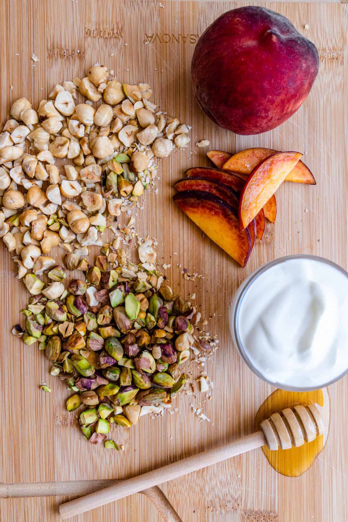 Frozen yogurt bark ingredients on a chopping board