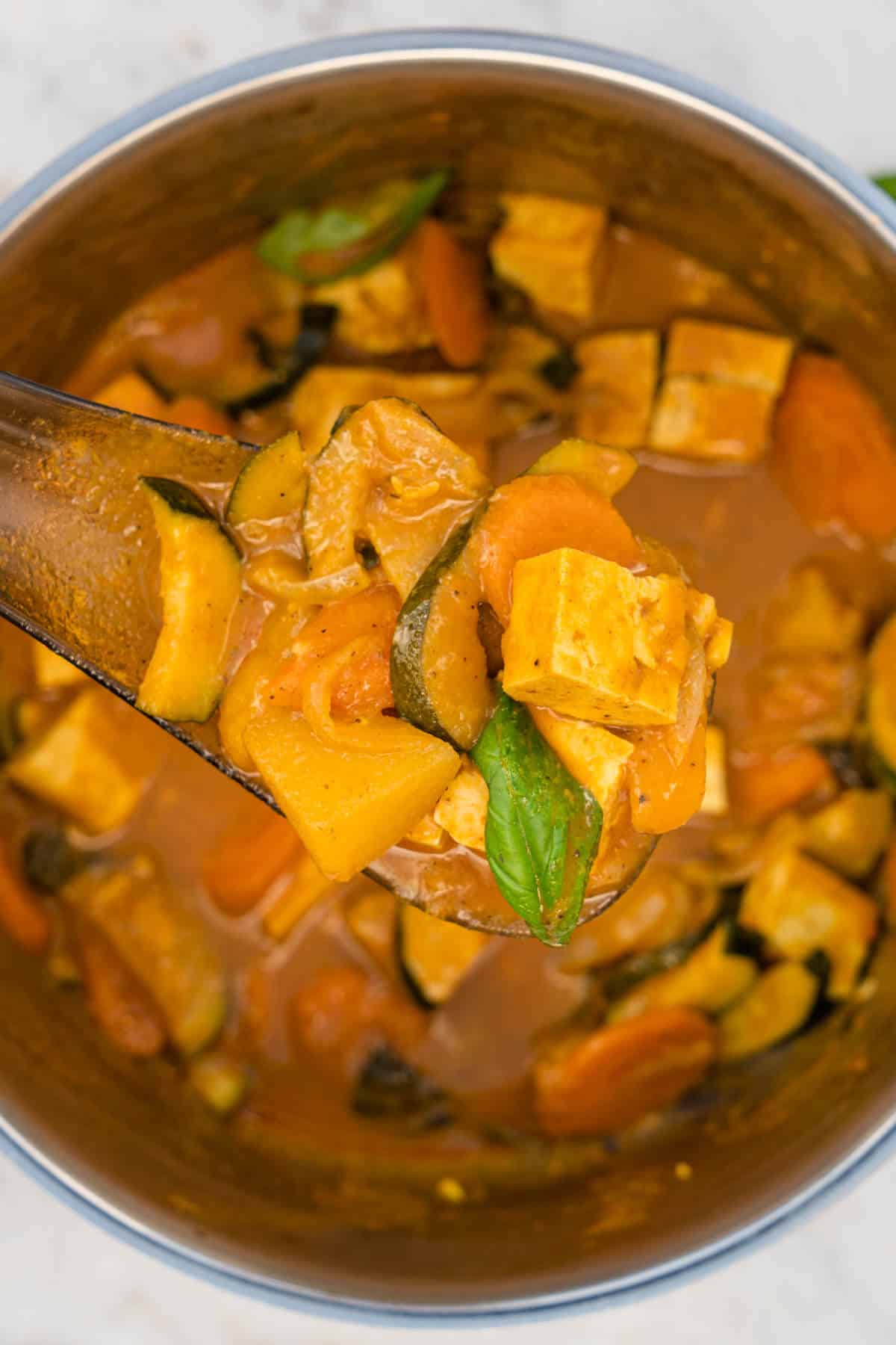 Close up of spoon vegan thai yellow curry