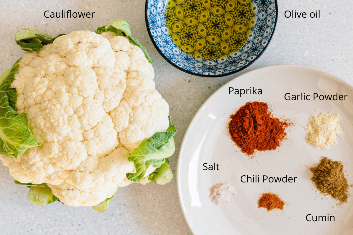 Ingredients to make roasted cauliflower steaks with a spice rub