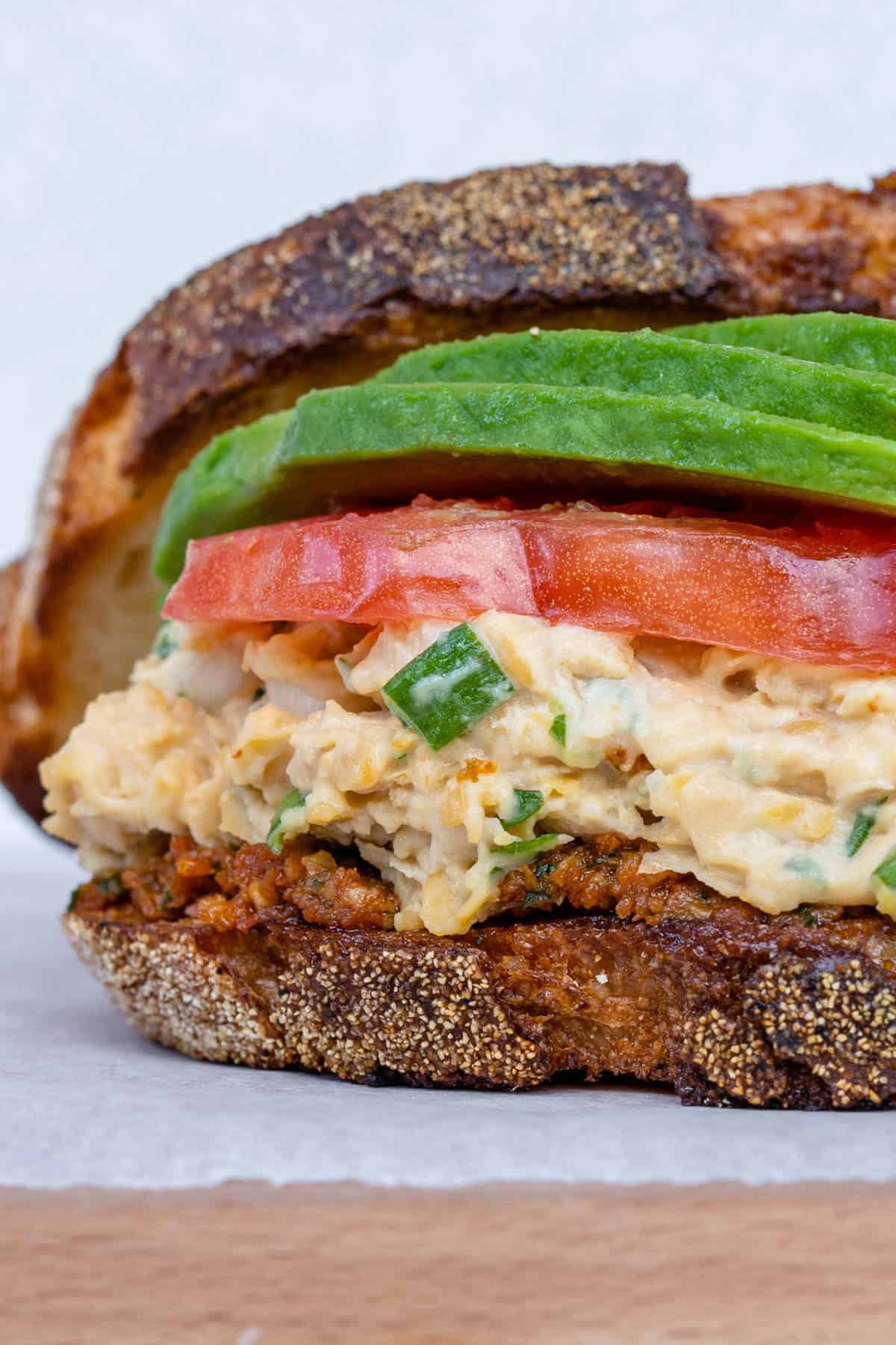 Chickpea tuna salad sandwich with tomato and avocado