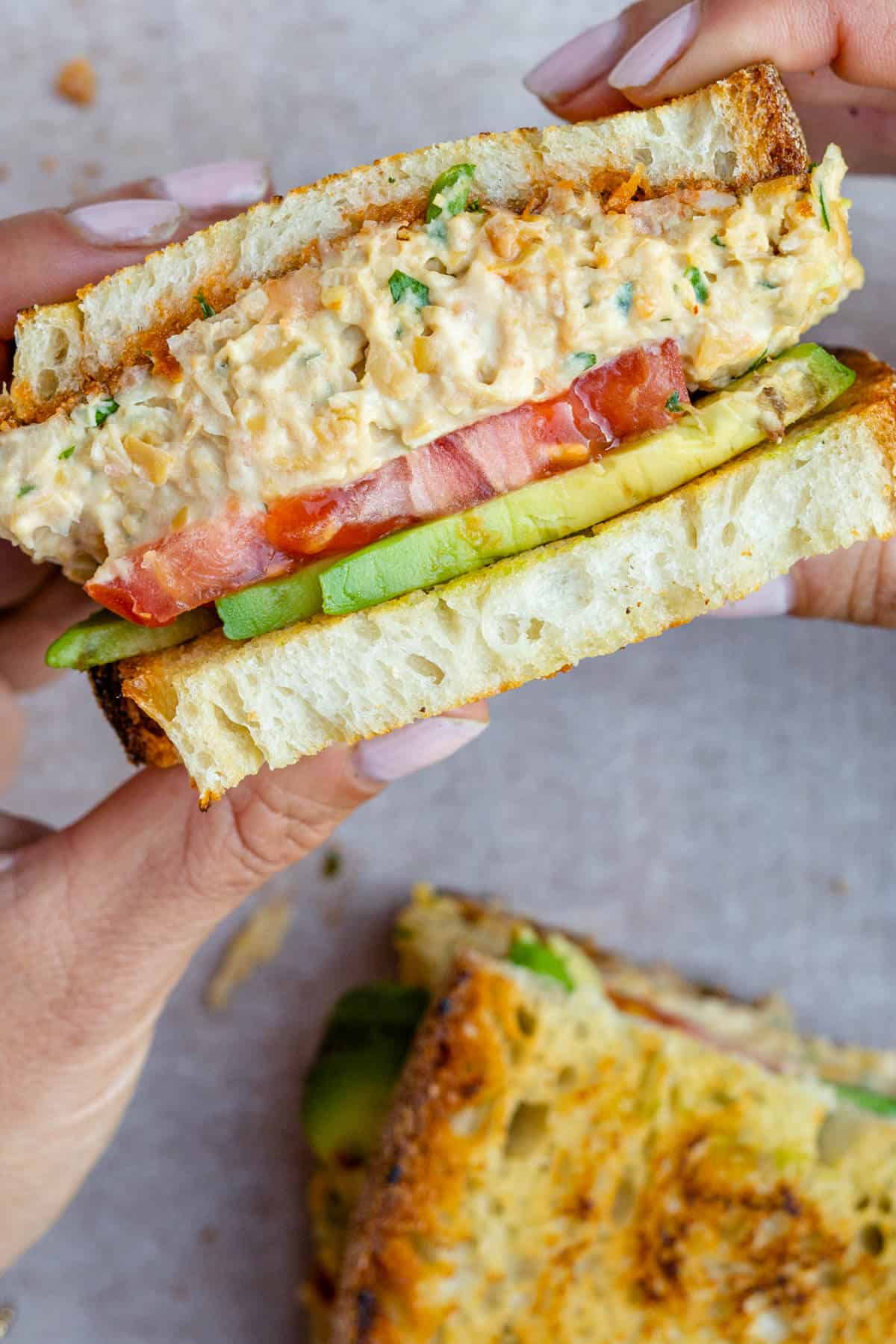 Half of chickpea tunacado sandwich to show the inside