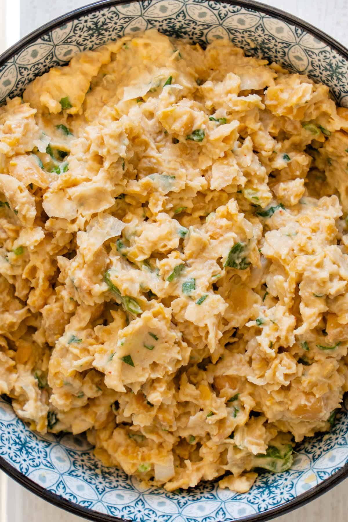 Close up of chickpea tuna mixture in a bowl