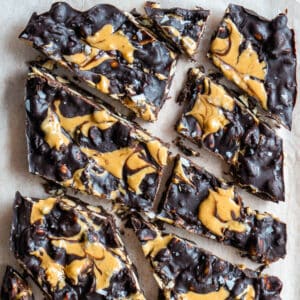 Chocolate bark chopped into pieces on baking paper