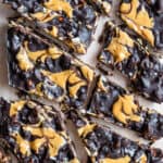 Chocolate bark chopped into pieces on baking paper
