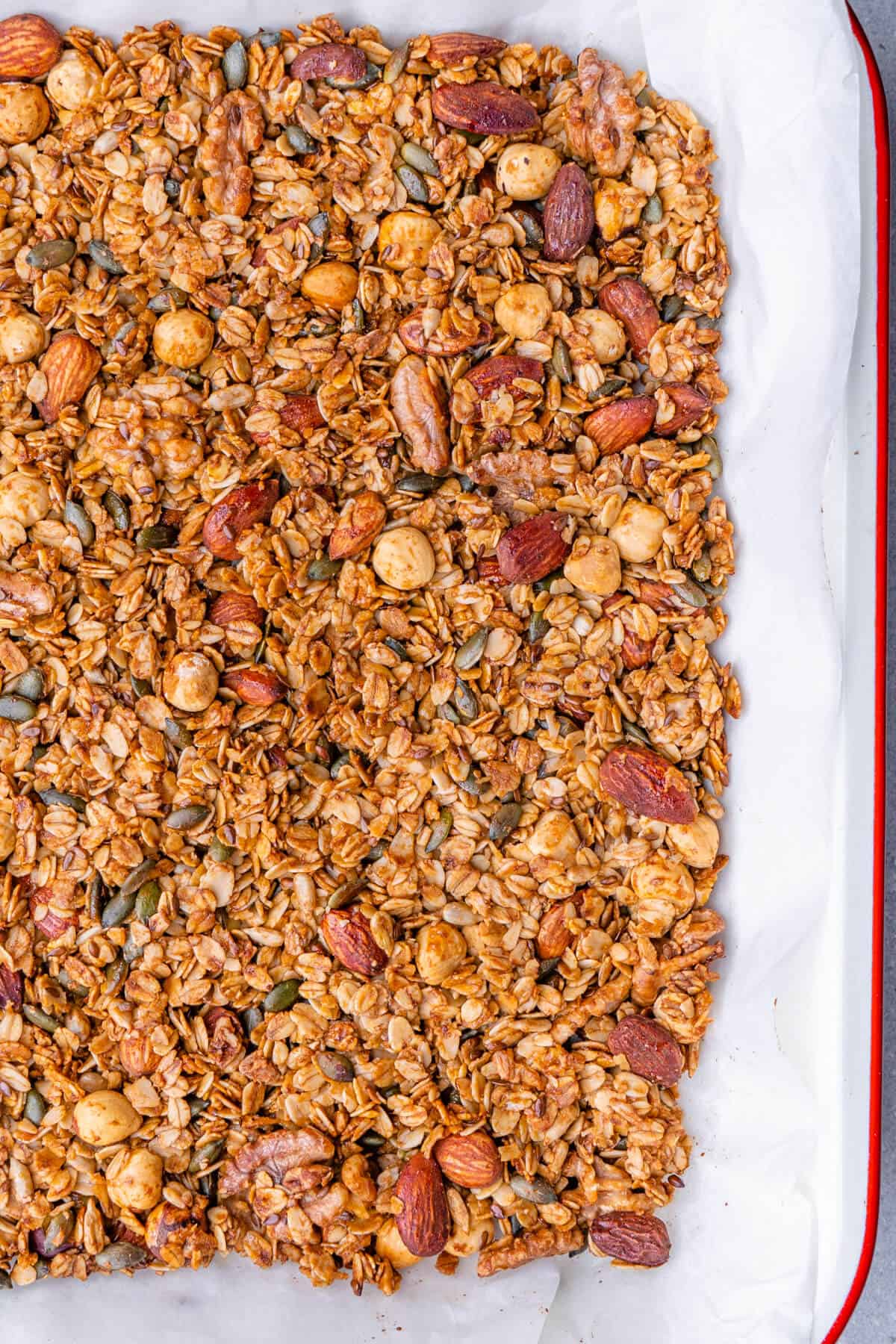 Healthy homemade granola resting on a baking tray