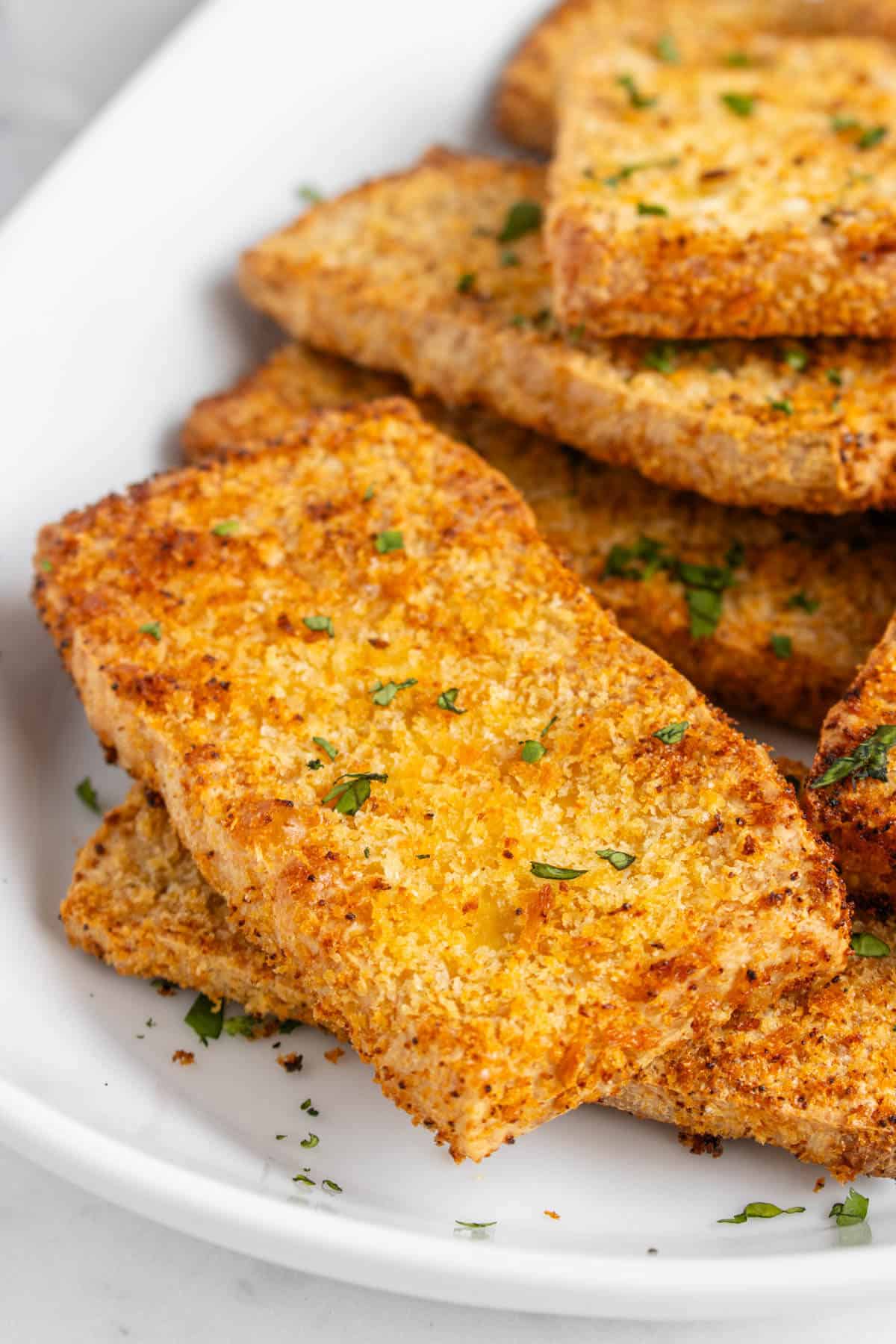 Close up of breaded tofu pieces on a plate