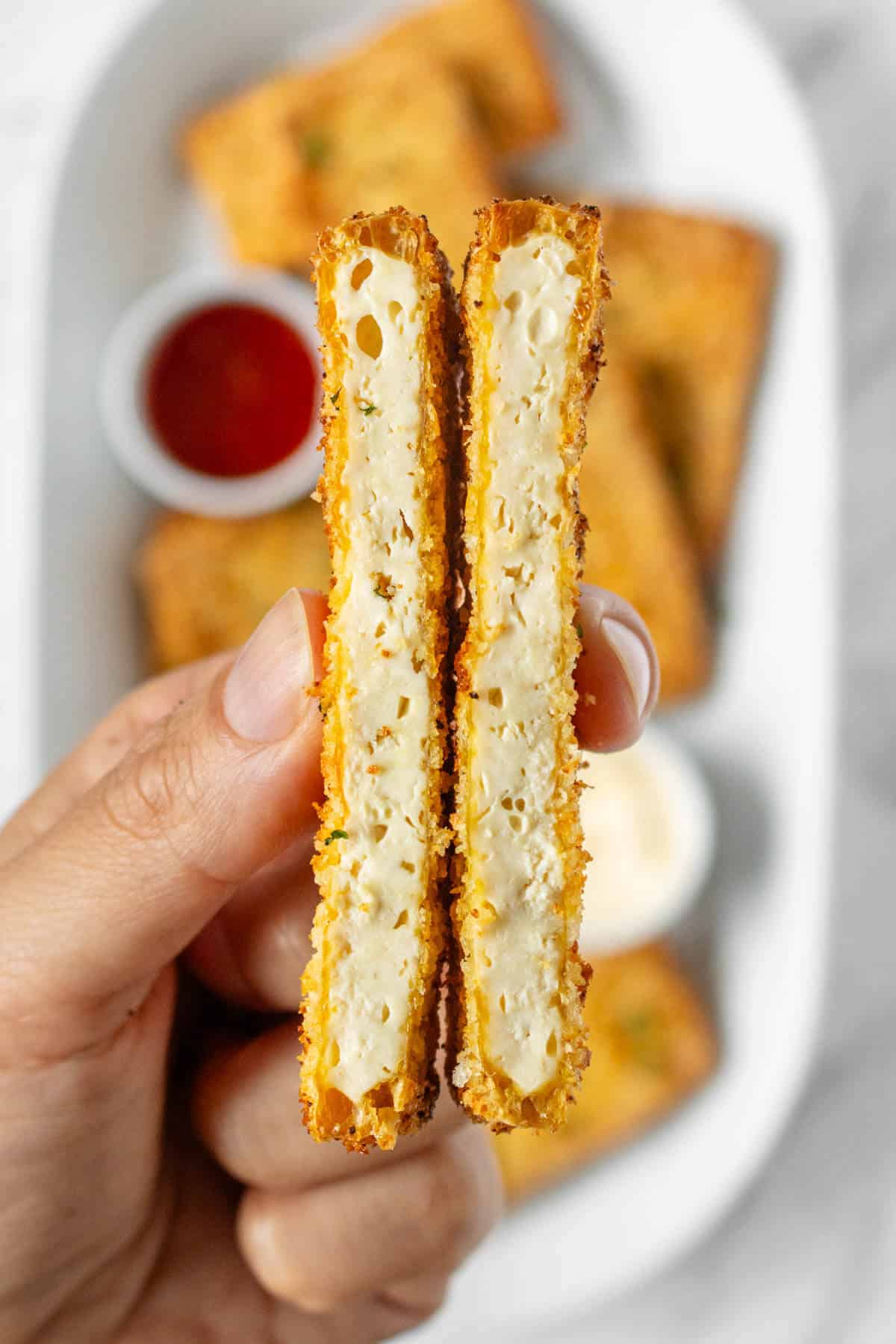 Close up of the inside of one piece of breaded panko tofu