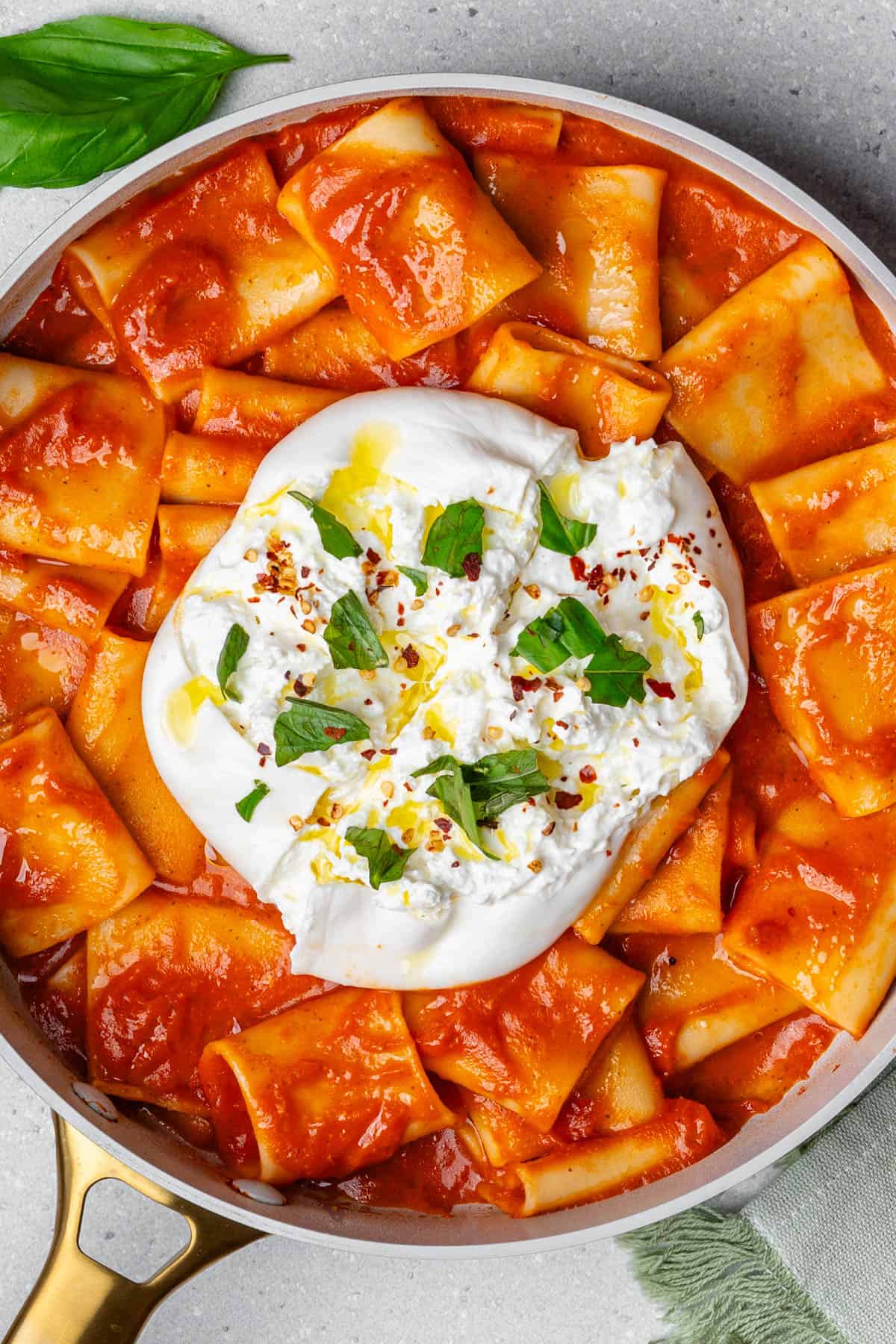 Burrata pasta served with a rich tomato sauce with the burrata cheese on top