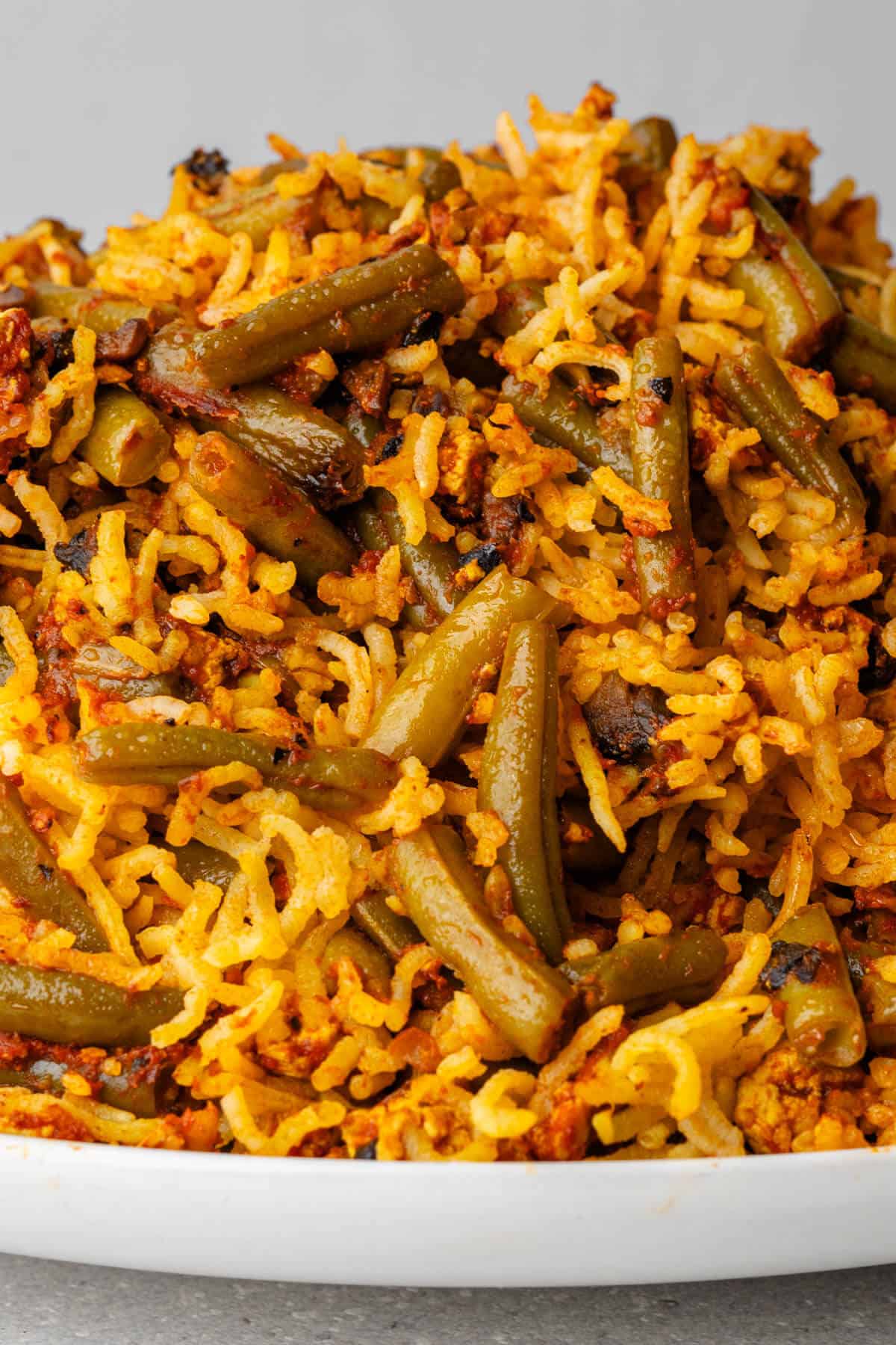 Close up of Lubia Polo to show the tomato rice with green beans