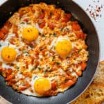 Persian Omelette in a pan with bread on the side