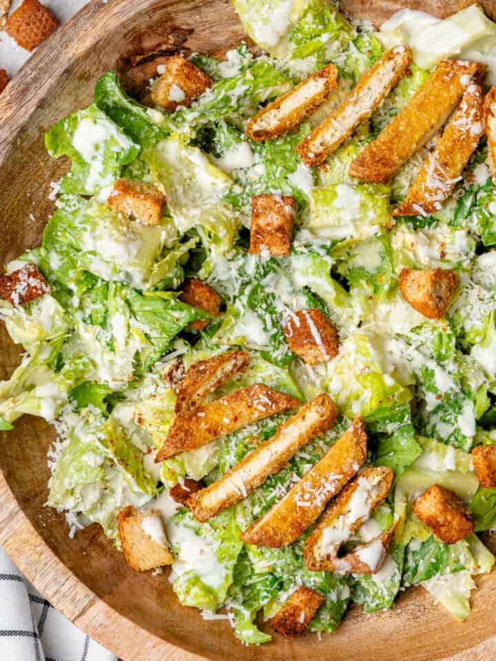 Healthy Caesar Salad served in a big wooden bowl