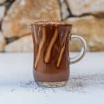 Italian Marocchino Coffee served in a glass topped with cacao