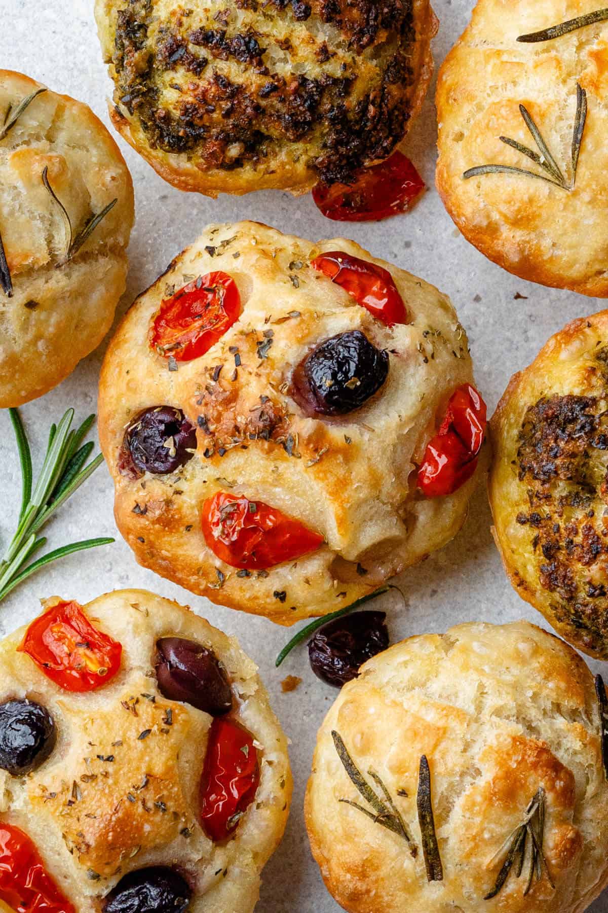 3 types of focaccia muffins with a focus on the tomato and olive flavor