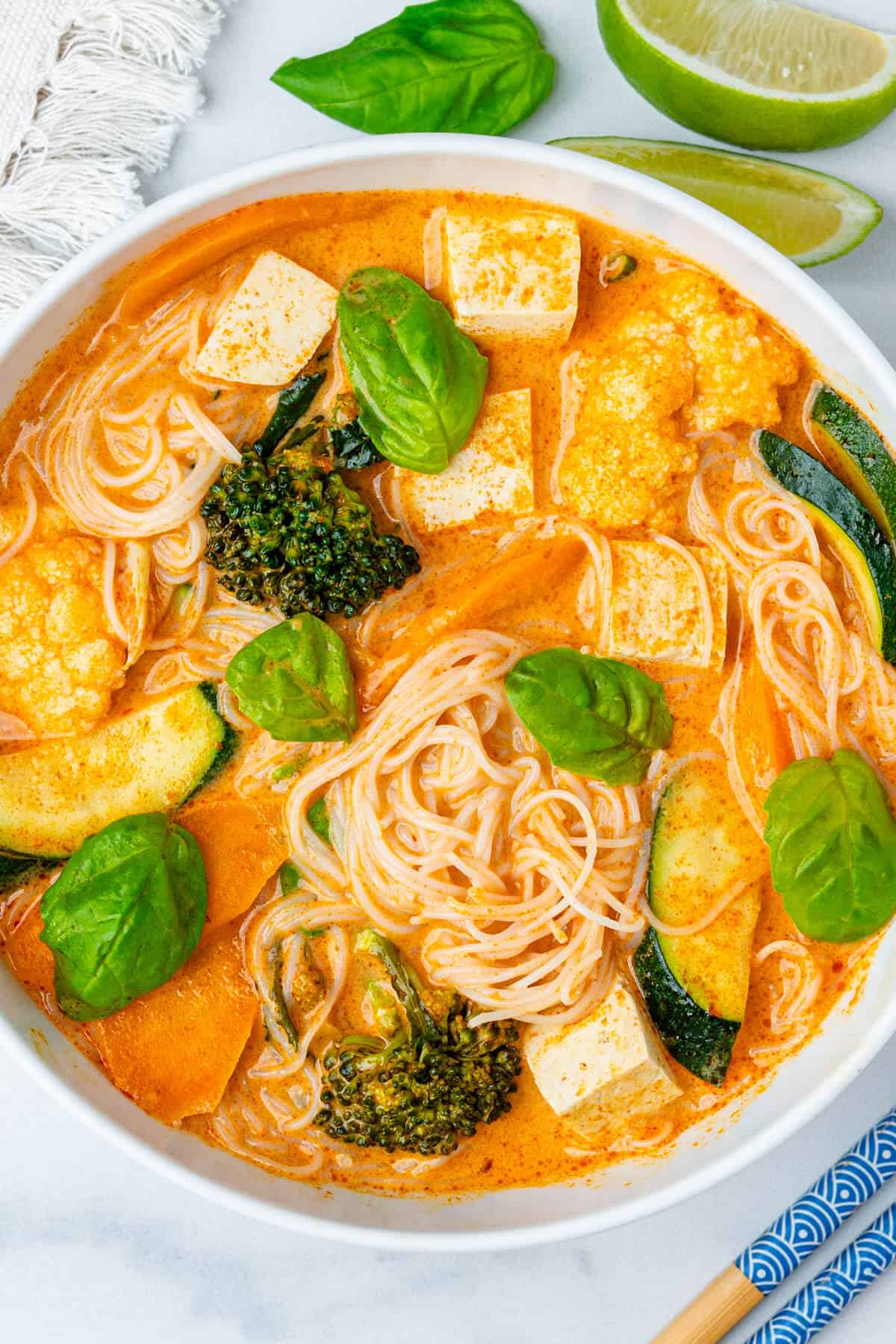 Spicy Thai Red Curry Soup in a bowl topped with basil