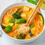 Thai Red Curry Soup with chop sticks inside a bowl