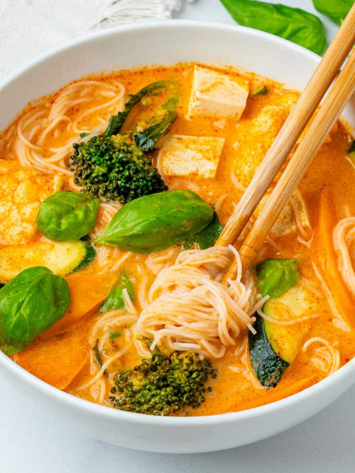 Thai Red Curry Soup with chop sticks inside a bowl