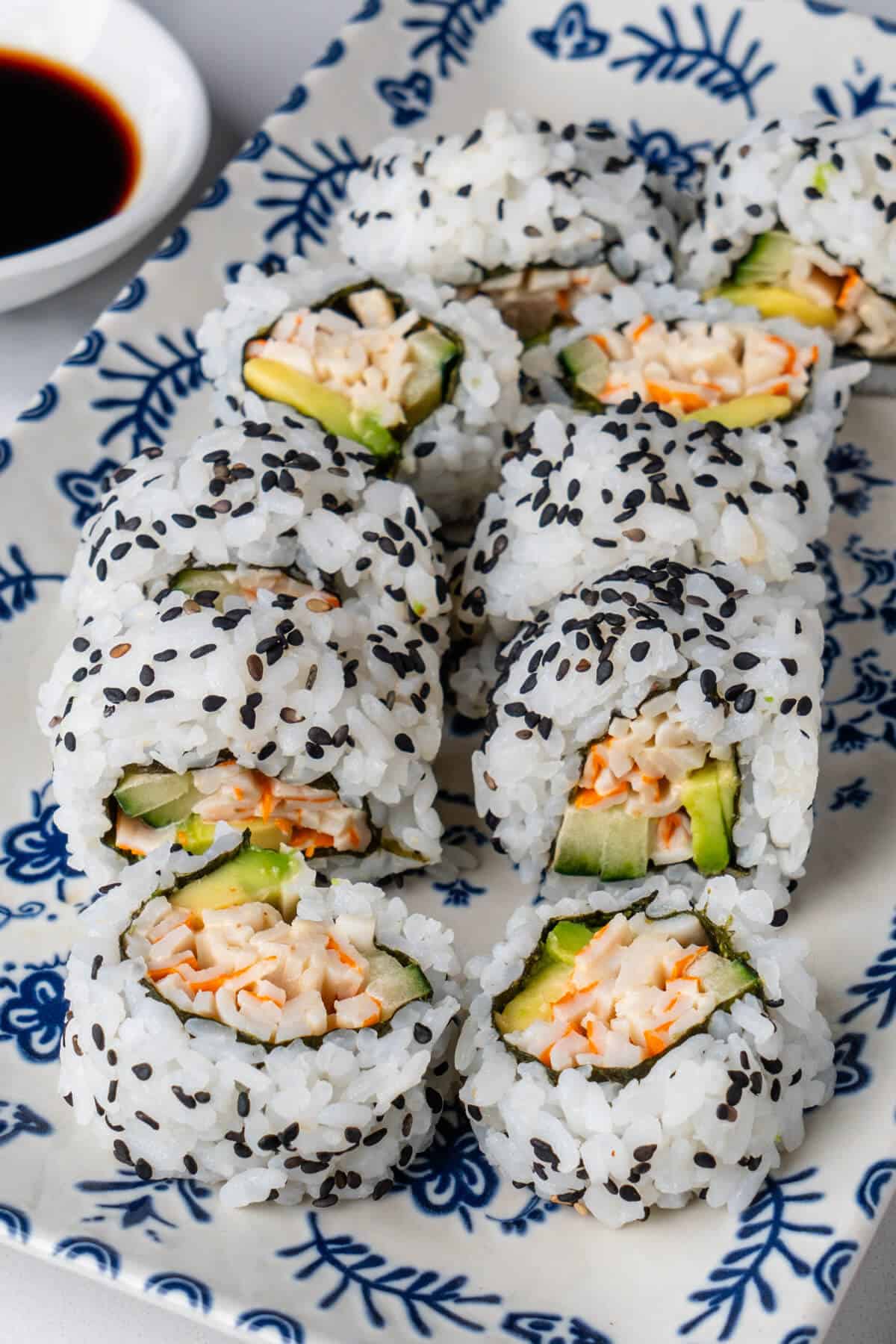 Kani Sushi pieces topped with black sesame