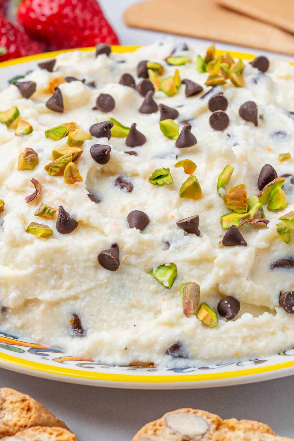 Plate of dip with pistachios and choc chips
