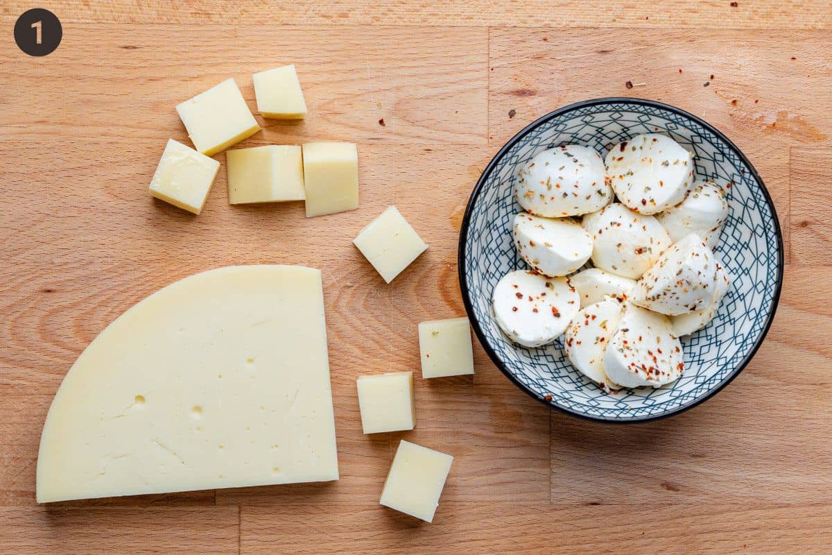 Cheese being prepared on a chopped board
