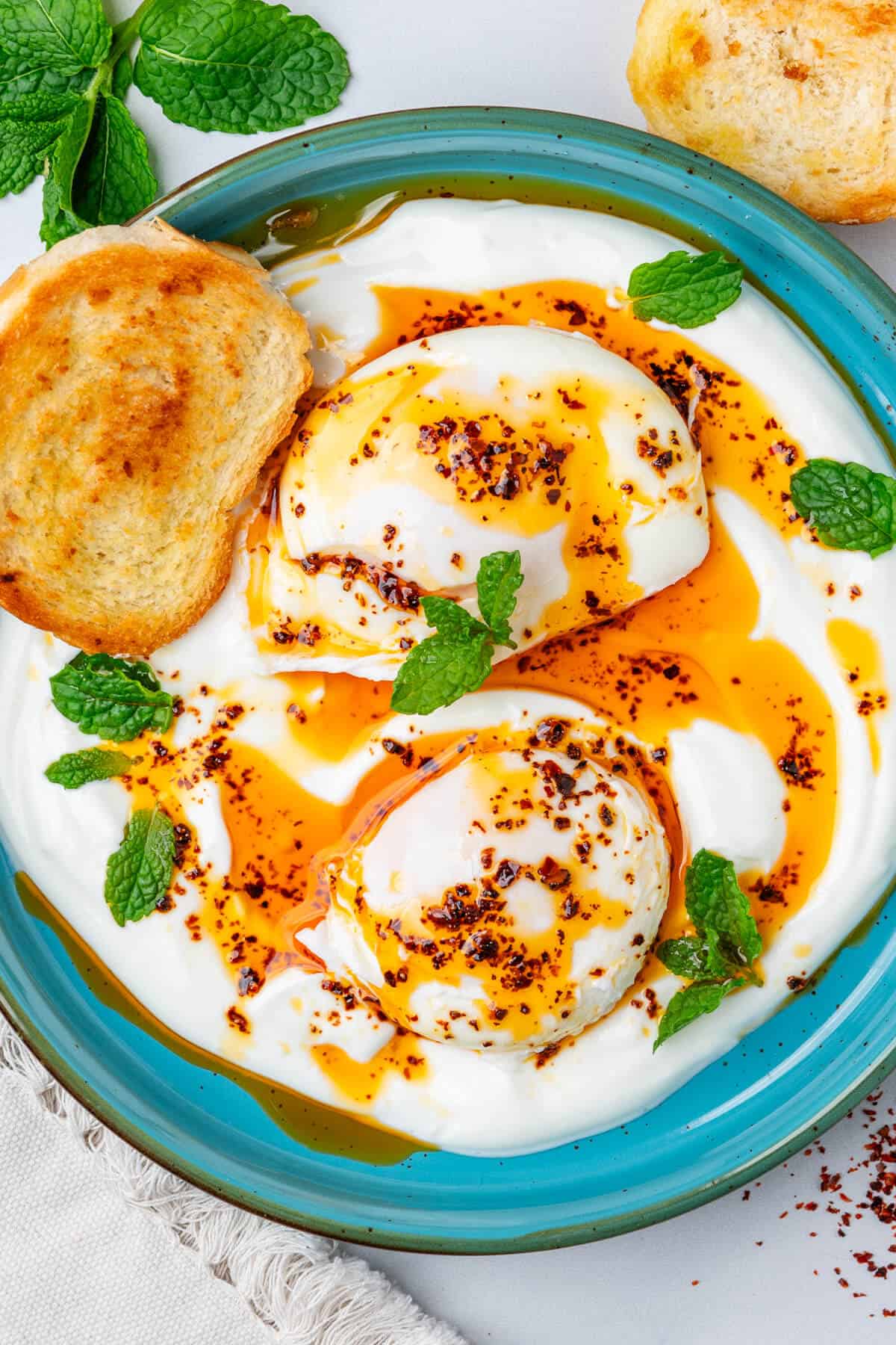 Turkish eggs with fresh mint and toasted bread
