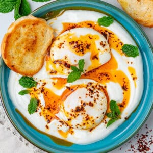 Cilbir Turkish Eggs served with toasted bread