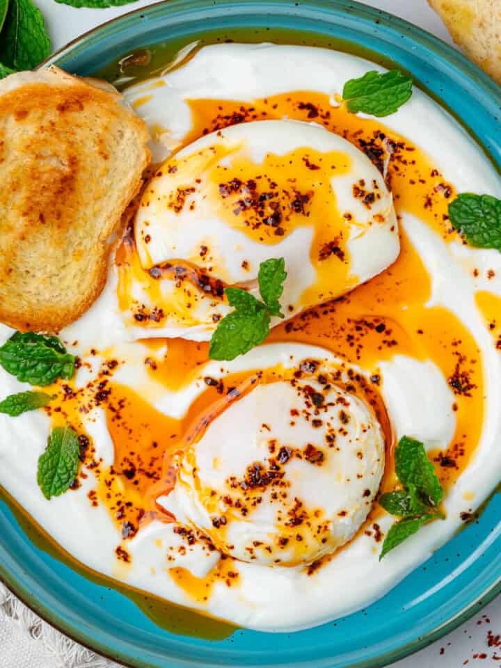 Cilbir Turkish Eggs served with toasted bread