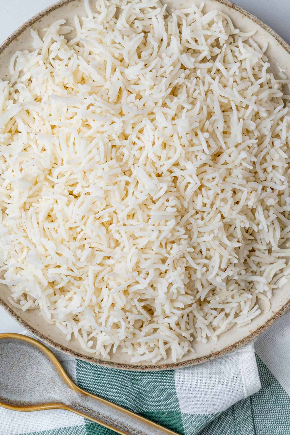 Basmati rice in a large plate with a spoon