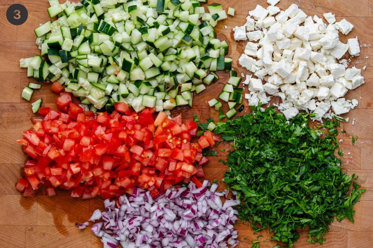 Salad ingredients all chopped on a board