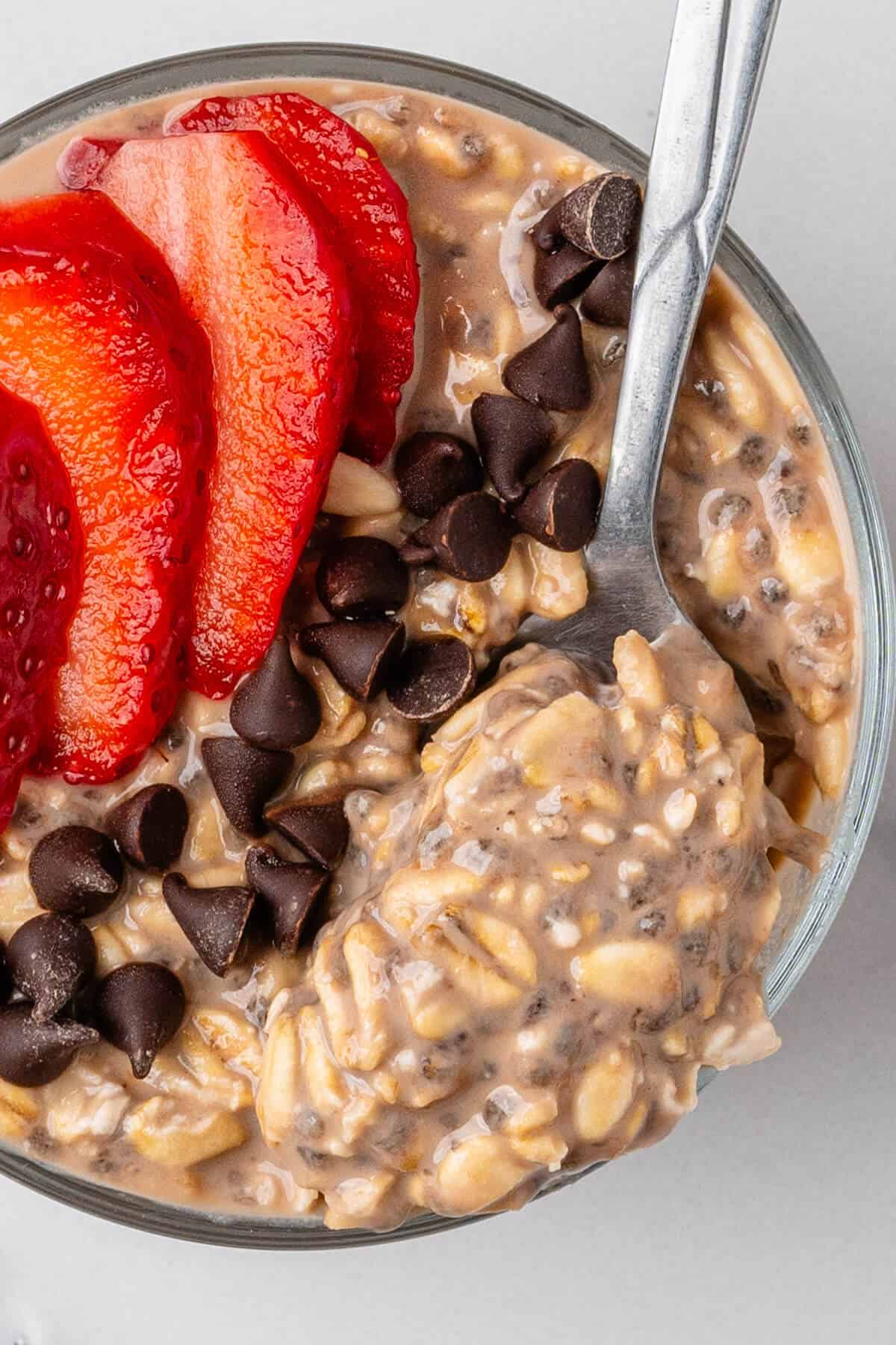 Close up of spoon in a chocolate overnight oats