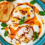 Cilbir Turkish Eggs served spice oil and toasted bread