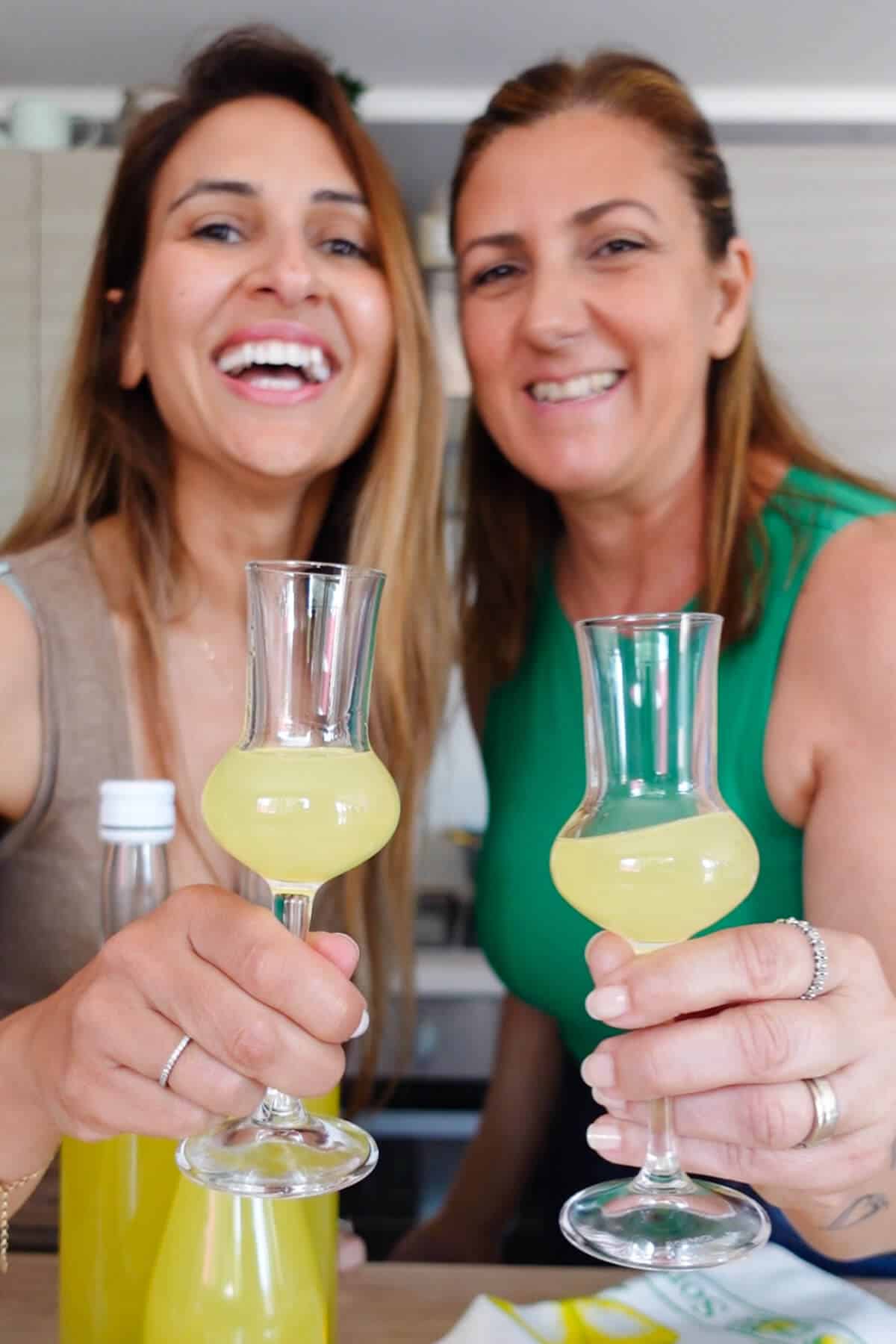 Ayeh and Ciniza holding glasses of limoncello