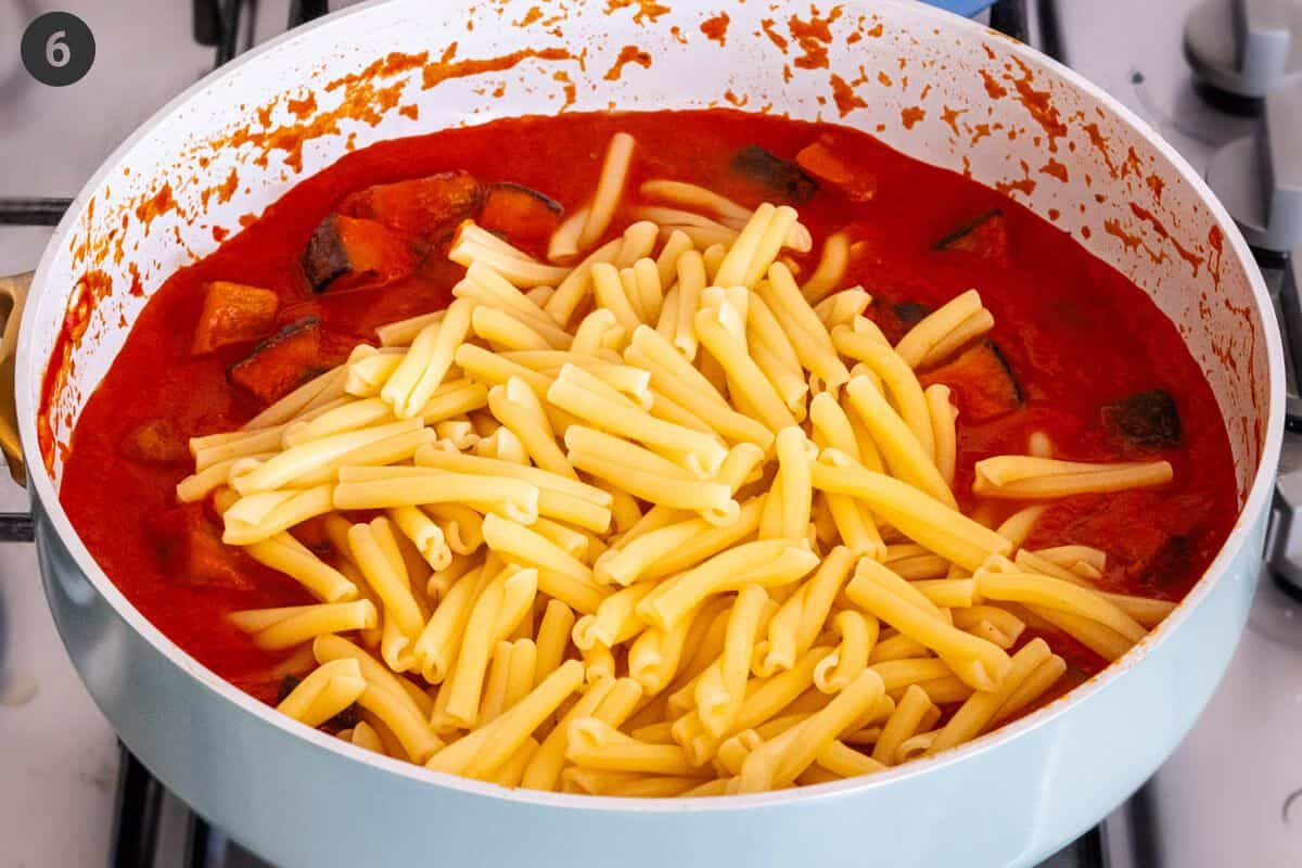 Pasta added to cooked tomato sauce pan